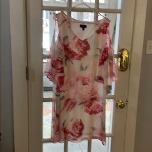 Dress with peek a boo sleeves.